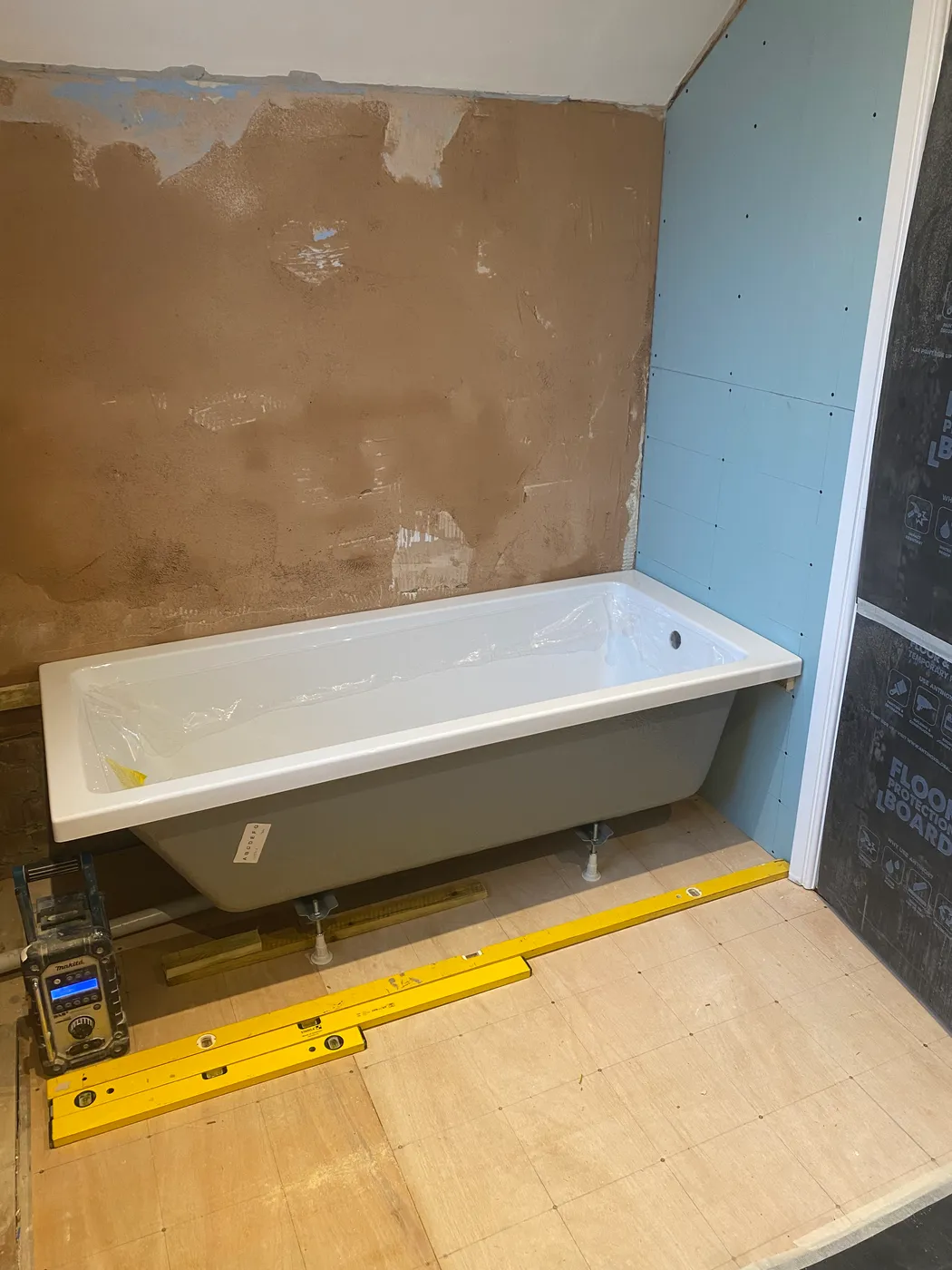 Bath set and walls plastered, ready for tiling — Project Fox, Surrey & Sussex