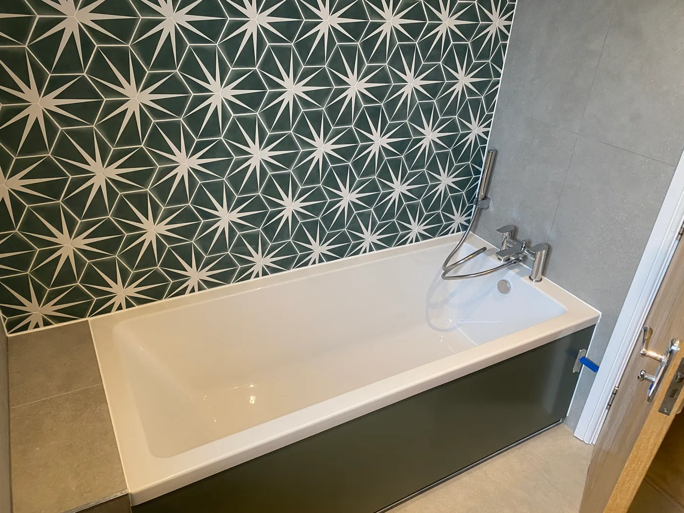 Fitted bath with patterned feature wall — Project Fox, Surrey & Sussex